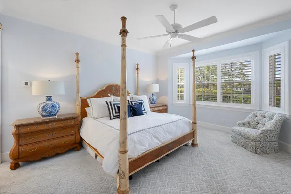 a bedroom with bed and window