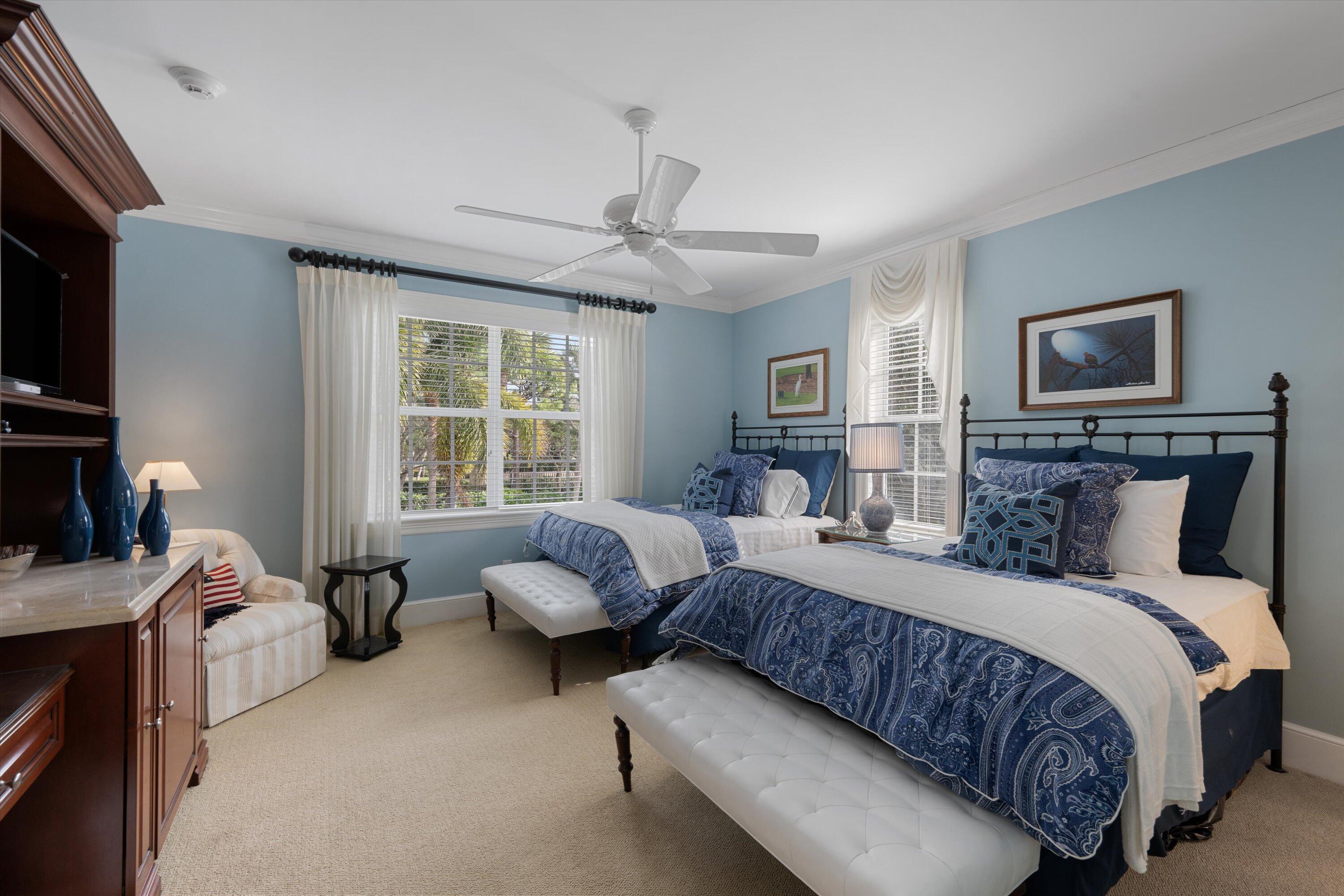 113 Caballo Lane Jupiter, FL 33458 - Photo 40 of 51 a bedroom with a bed furniture and a flat screen tv