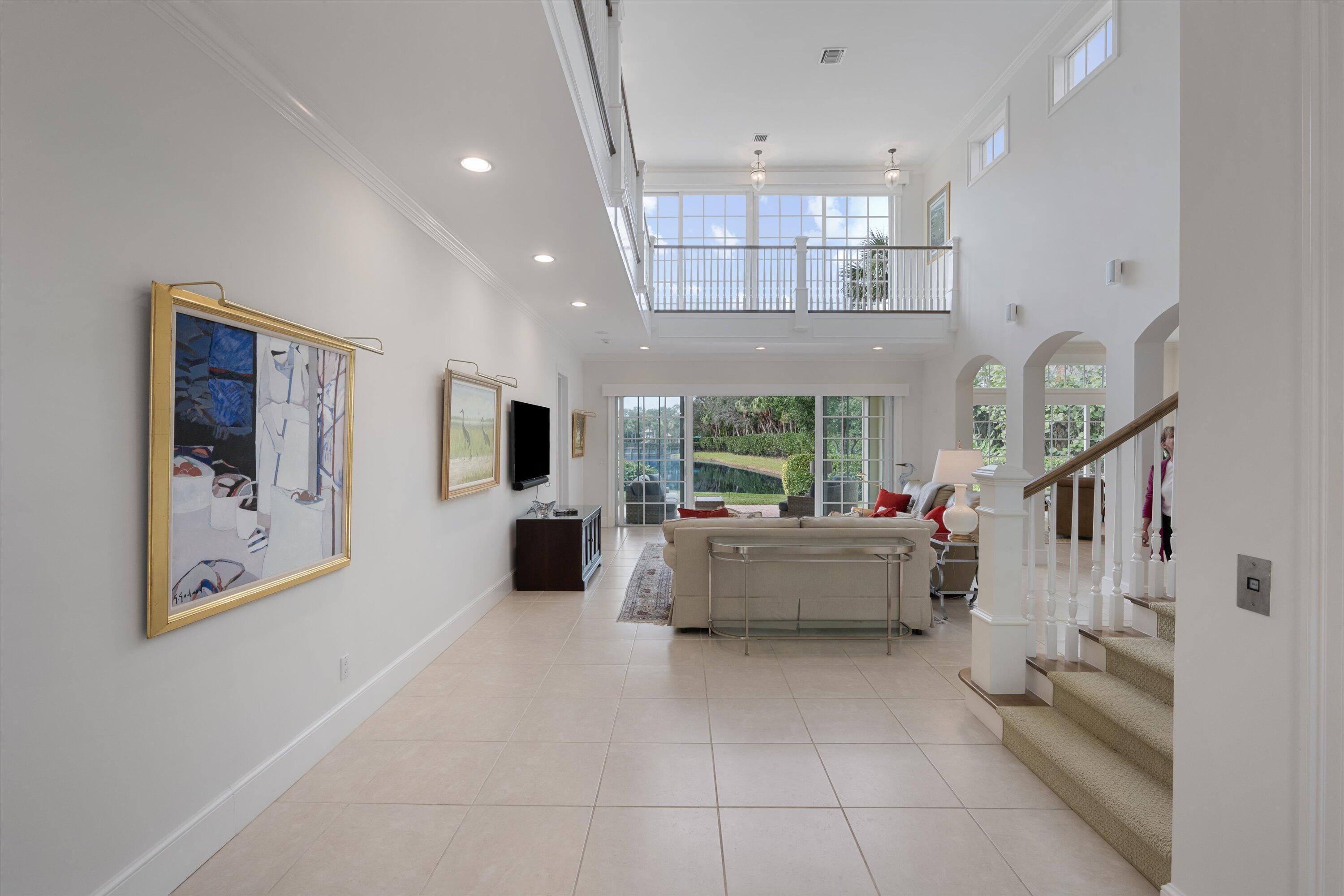 113 Caballo Lane Jupiter, FL 33458 - Photo 4 of 51 a living room with furniture and a flat screen tv