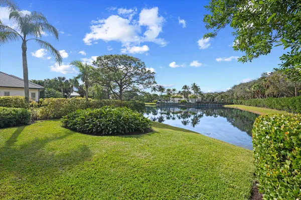a view of a lake with a yard