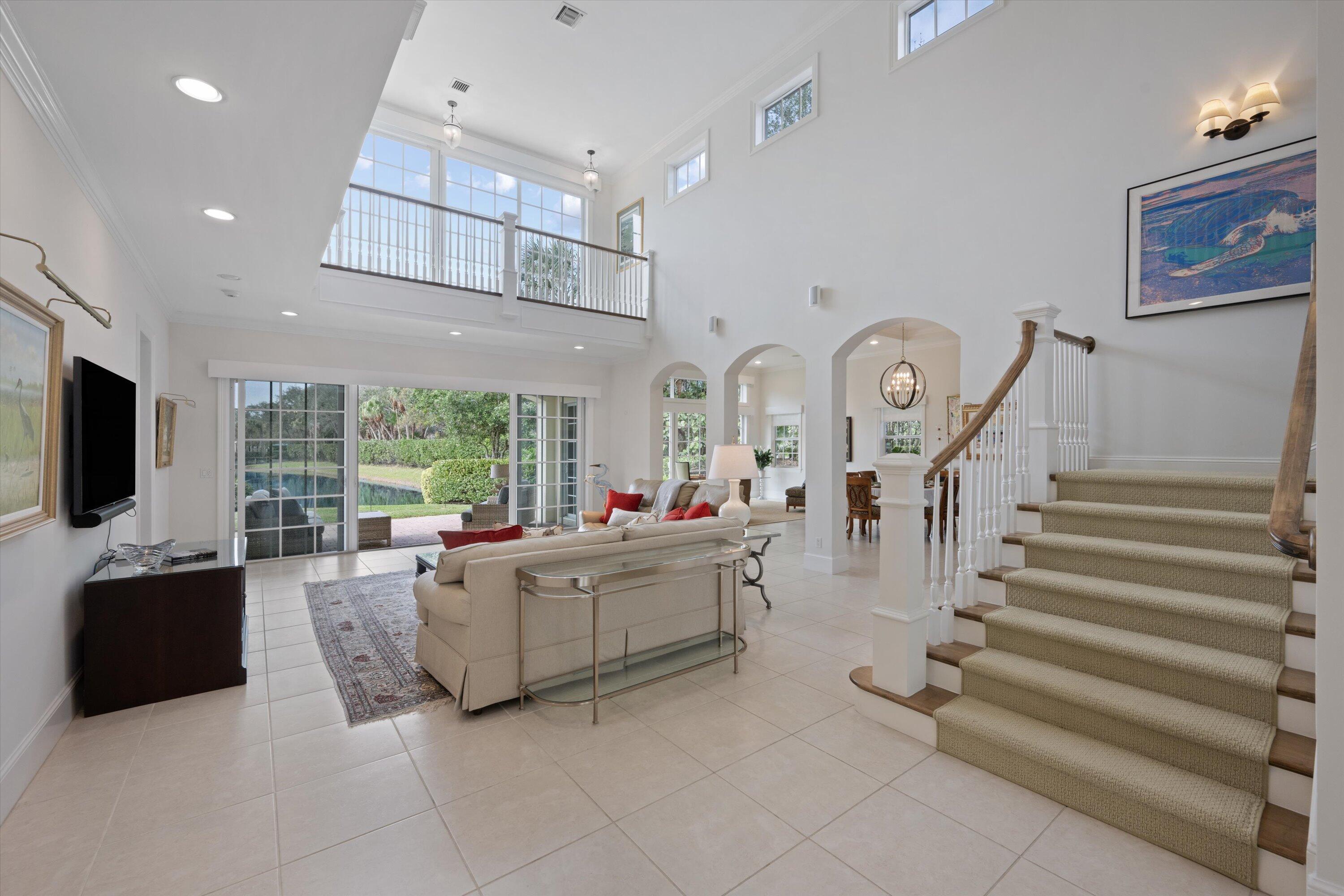 113 Caballo Lane Jupiter, FL 33458 - Photo 9 of 51 a living room with fireplace furniture and a flat screen tv