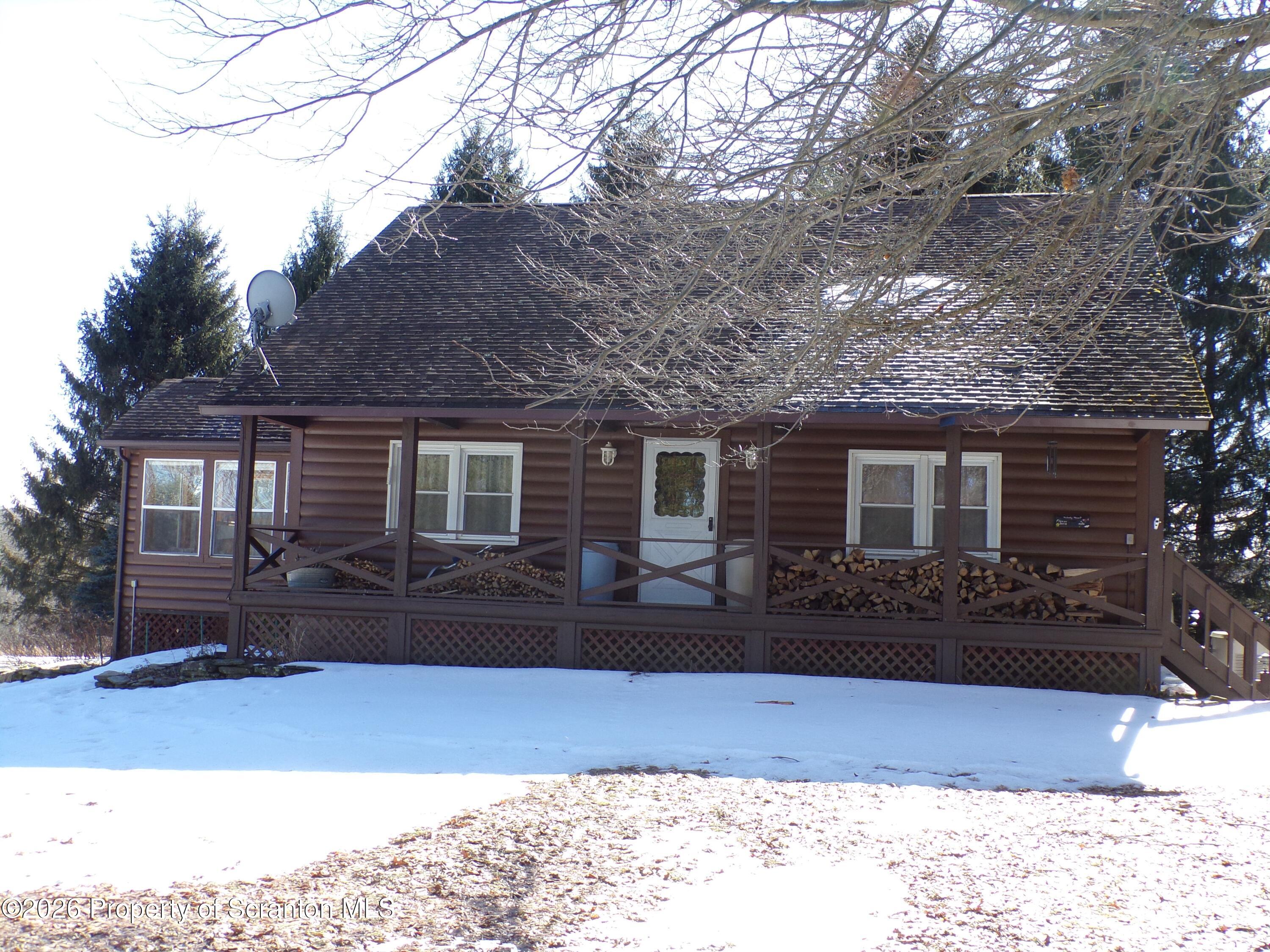 2590 Potter Hill Road Thompson, PA 18465 - Photo 1 of 38 Front