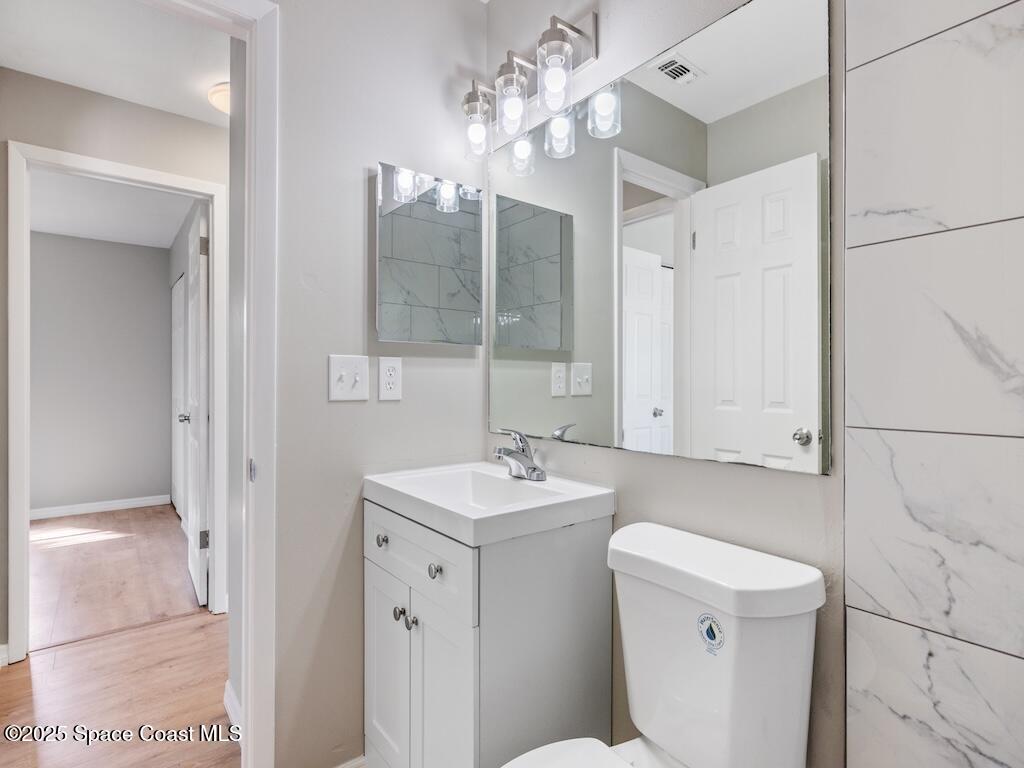 274 Trilby Road Southwest Palm Bay, FL 32908 - Photo 15 of 38 a bathroom with a sink toilet and shower
