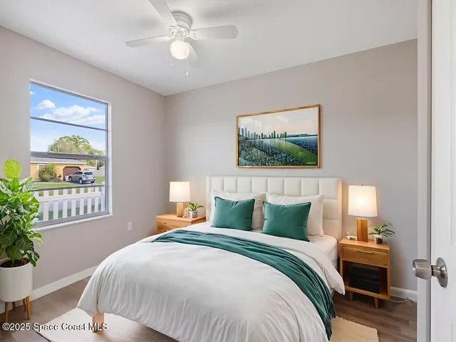 a bedroom with bed and a window