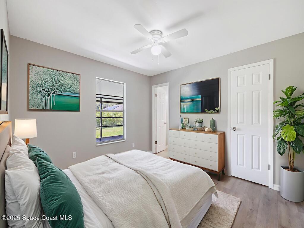 274 Trilby Road Southwest Palm Bay, FL 32908 - Photo 20 of 38 a bedroom with a bed and a flat screen tv