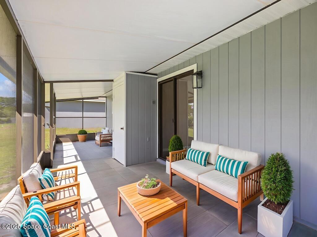 274 Trilby Road Southwest Palm Bay, FL 32908 - Photo 31 of 38 a living room with furniture and a potted plant