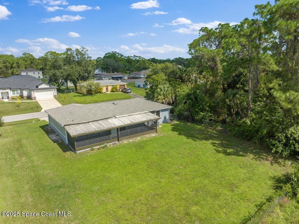 274 Trilby Road Southwest Palm Bay, FL 32908 - Photo 35 of 38 a view of swimming pool with seating area and green space