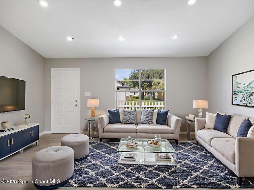 274 Trilby Road Southwest Palm Bay, FL 32908 - Photo 6 of 38 a living room with furniture and a flat screen tv