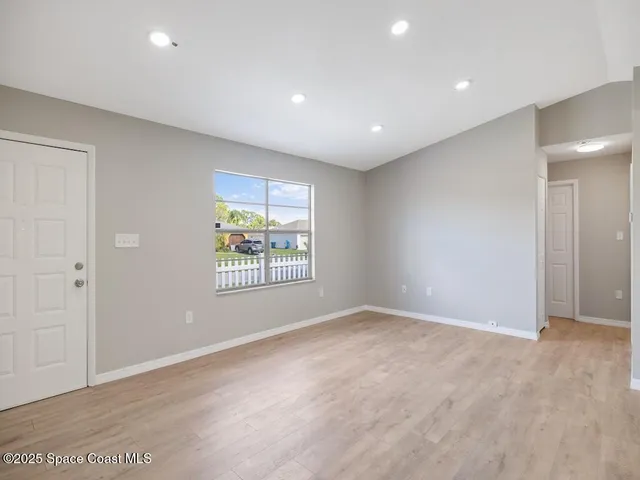 a view of an empty room with a window