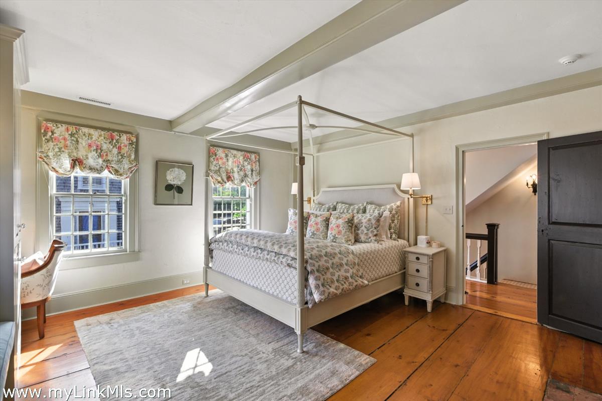 32 Union Street Nantucket, MA 02554 - Photo 10 of 30 a bedroom with a bed and a large window