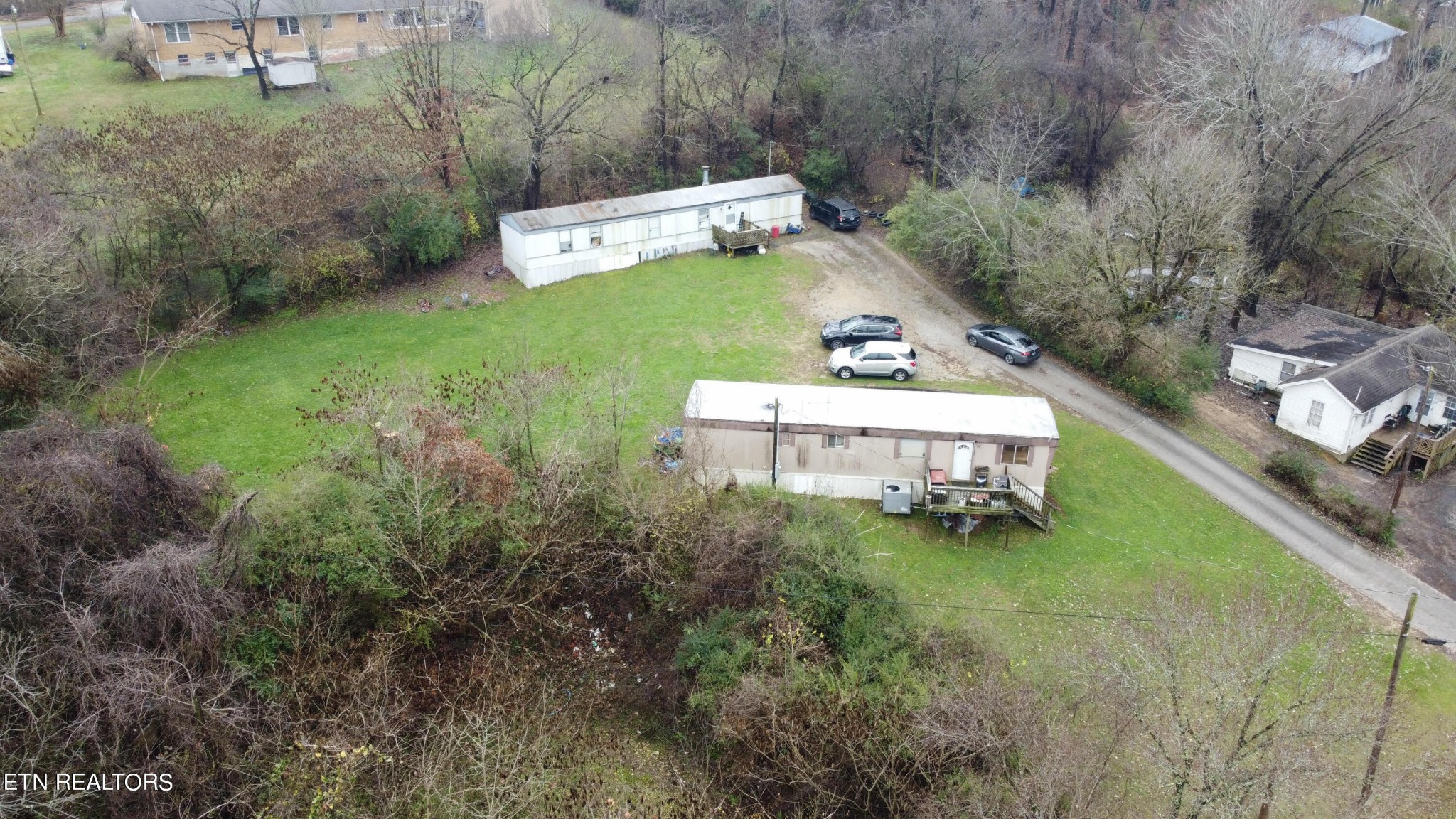 372 Longmire Road Clinton, TN 37716 - Photo 1 of 7 a view of a house with a yard
