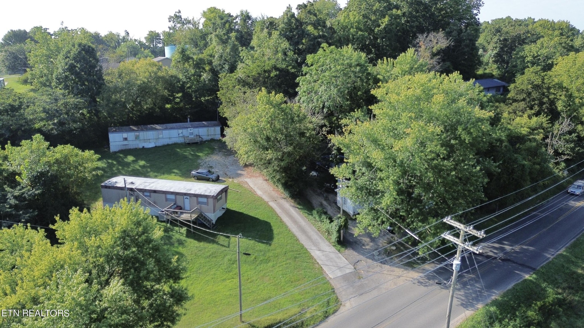 372 Longmire Road Clinton, TN 37716 - Photo 2 of 7 an aerial view of a house with a yard