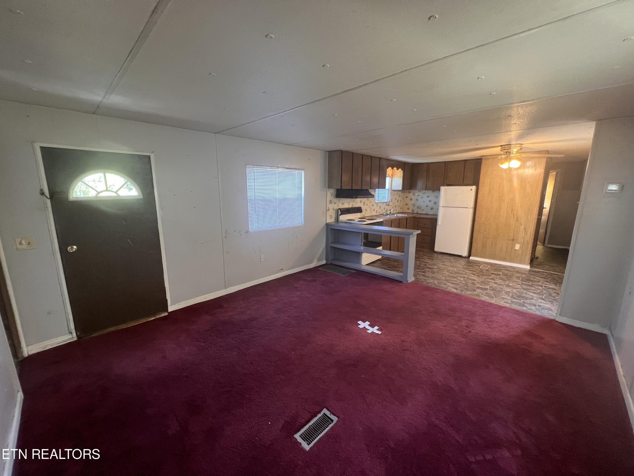 372 Longmire Road Clinton, TN 37716 - Photo 3 of 7 a view of a livingroom with furniture and a window