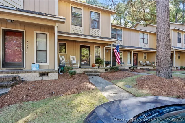a view of a brick building with large windows