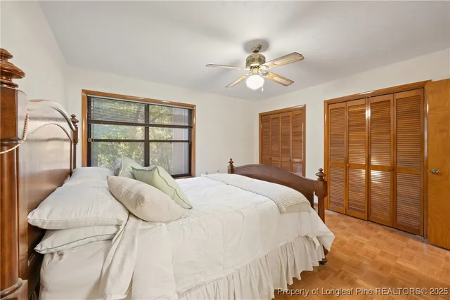 a bedroom with a large bed and a window