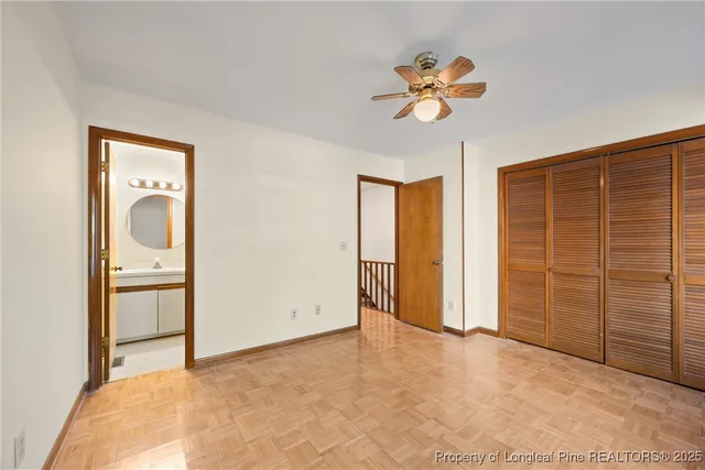 a view of empty room with ceiling fan