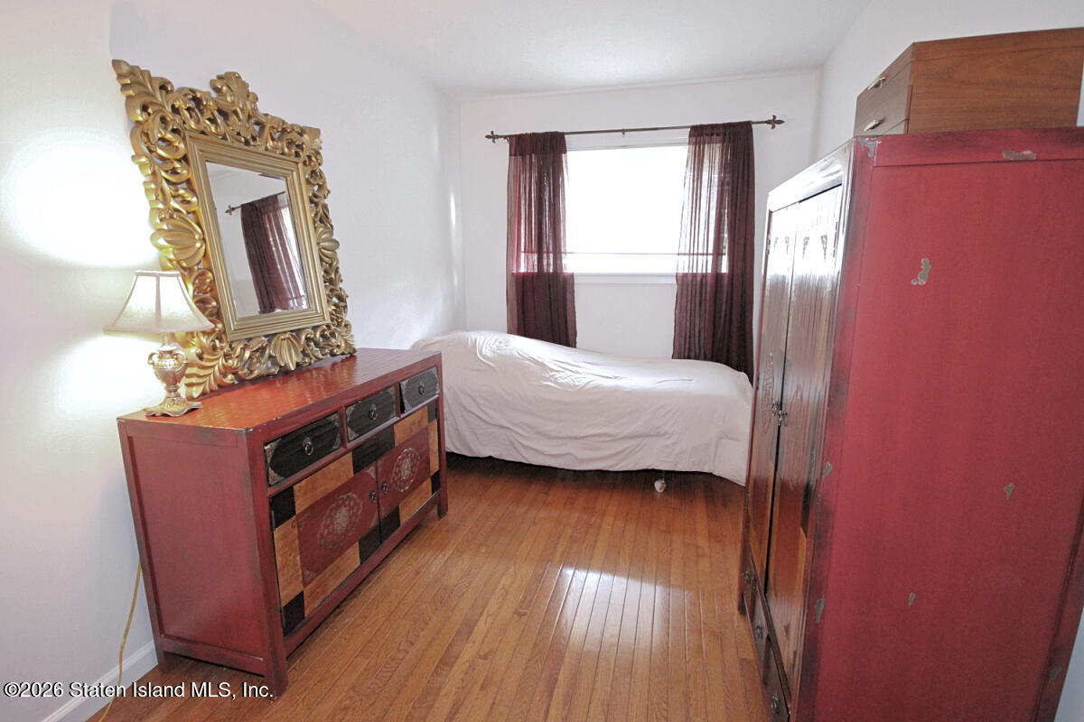 951 West Fingerboard Road Staten Island, NY 10304 - Photo 17 of 29 a bedroom with bed and window