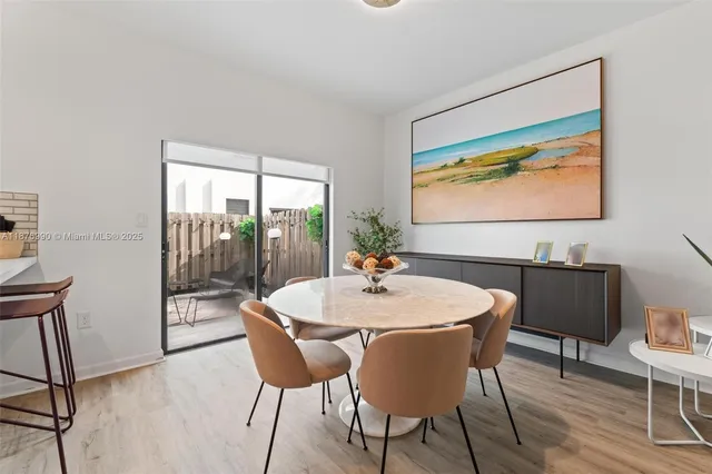 a kitchen with granite countertop a stove a sink and a refrigerator
