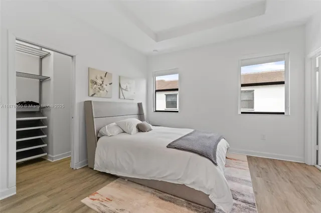 a bathroom with a double vanity sink toilet and shower