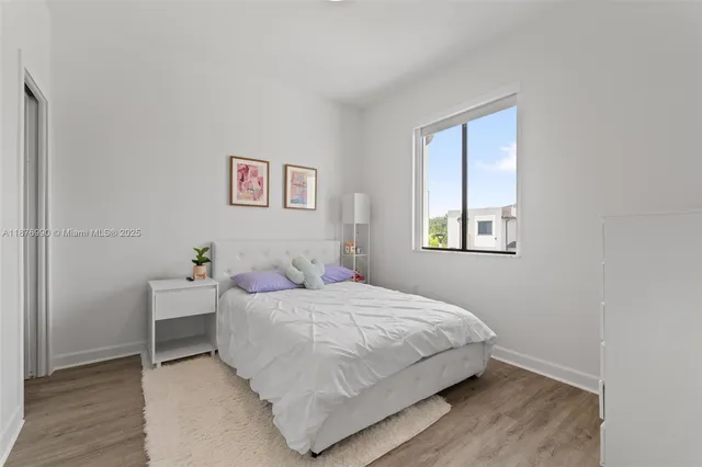 a bathroom with a sink toilet vanity and tub