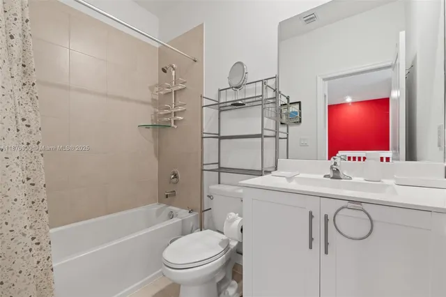 a bedroom with a bed and flat screen tv