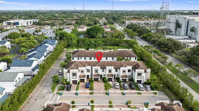a view of a sign board with a house in the background