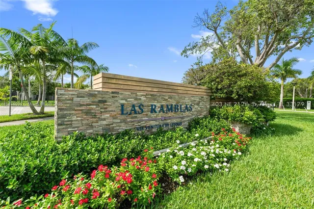 a view of a room with gym equipment and a large window