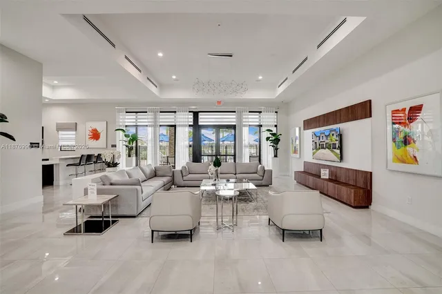 a view of a room with gym equipment and a large window