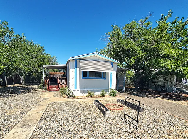 a view of a lounge chair and table in the patio
