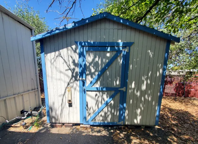 a wooden door in front of a house