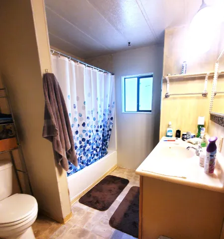 a room with wooden floors and window