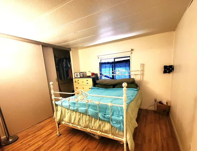a bed room with furniture and a table