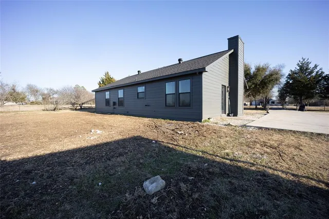 a view of water with a building in the background