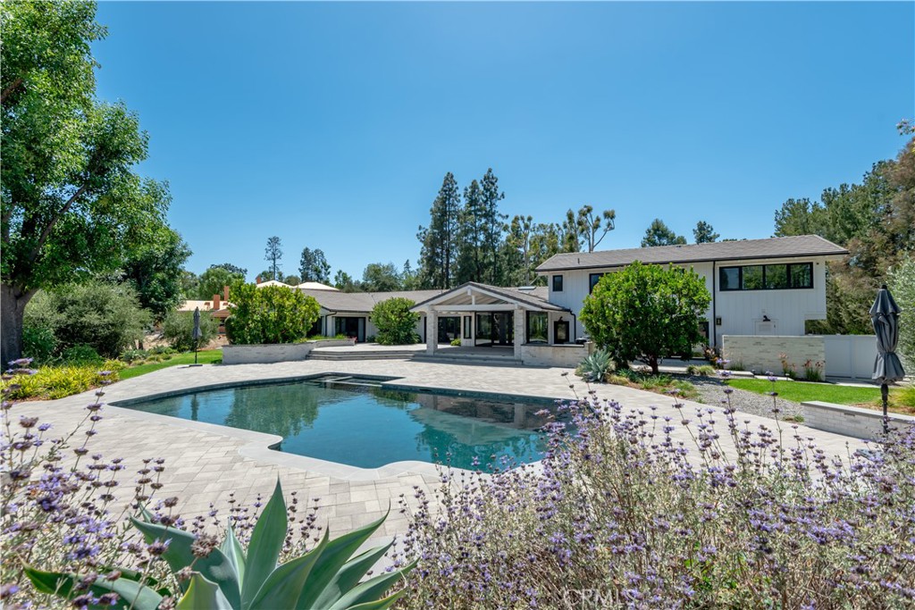 24884 Jim Bridger Road Hidden Hills, CA 91302 - Photo 26 of 31 a front view of a house with a yard