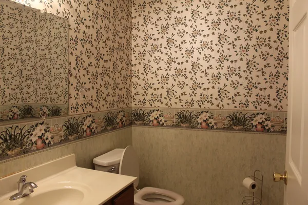 a view of bathroom with toilet and shower
