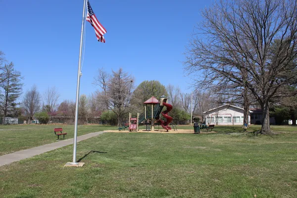 a view of a park with swings
