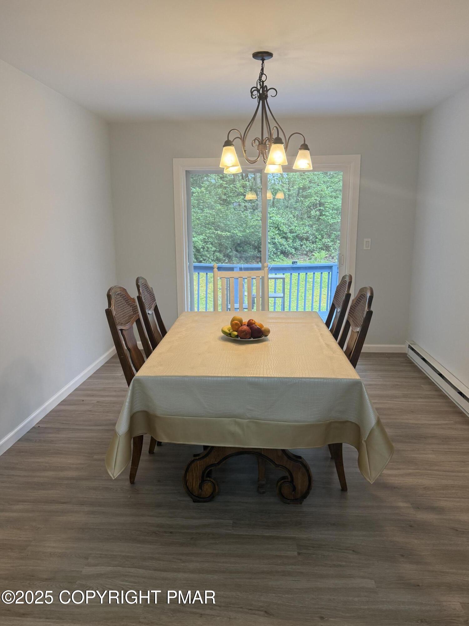 37 Seneca Road Mount Pocono, PA 18344 - Photo 11 of 46 a dining room with a table and chairs