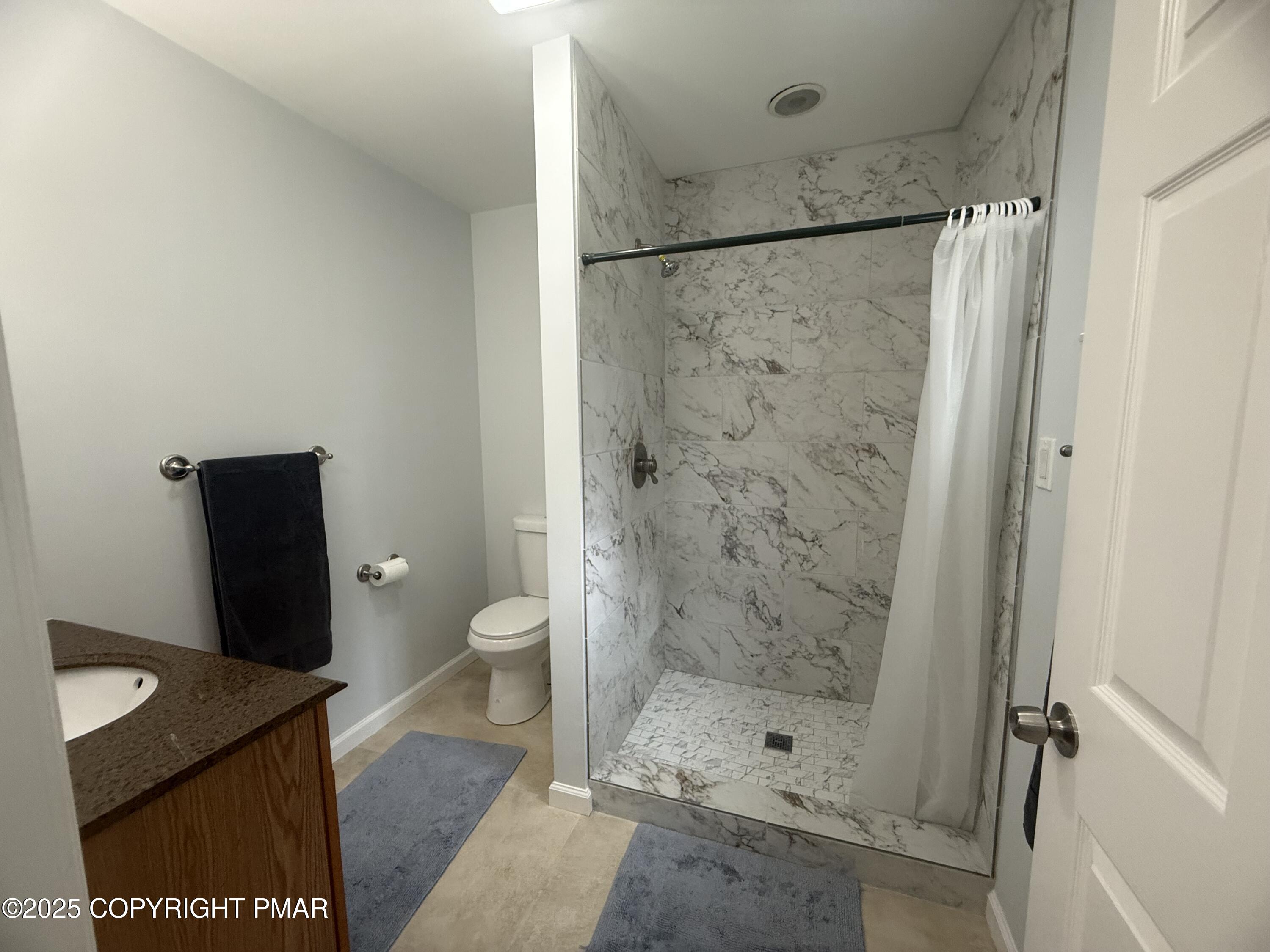 37 Seneca Road Mount Pocono, PA 18344 - Photo 20 of 46 a bathroom with a shower and a toilet