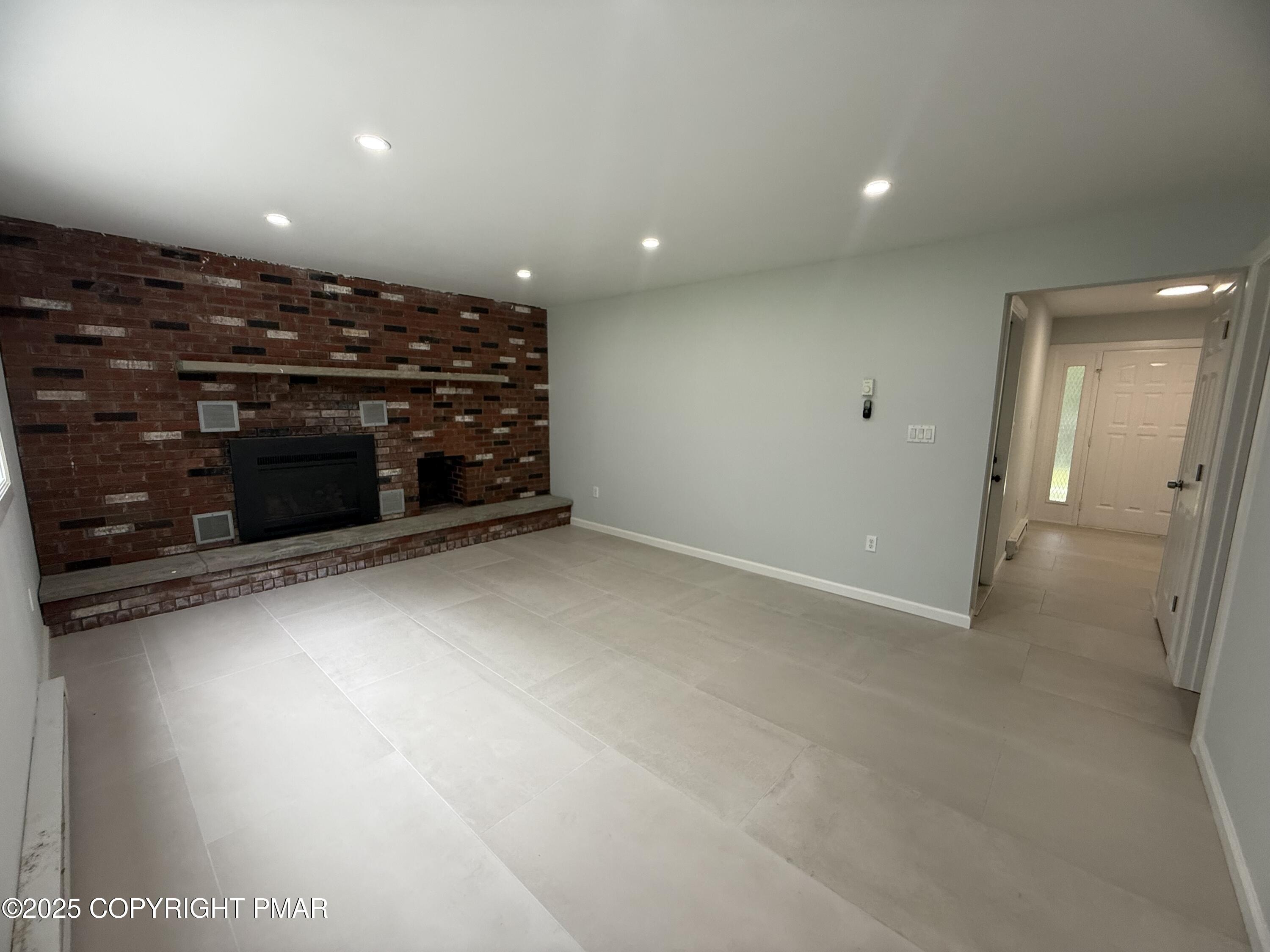 37 Seneca Road Mount Pocono, PA 18344 - Photo 33 of 46 a view of an empty room with a fireplace