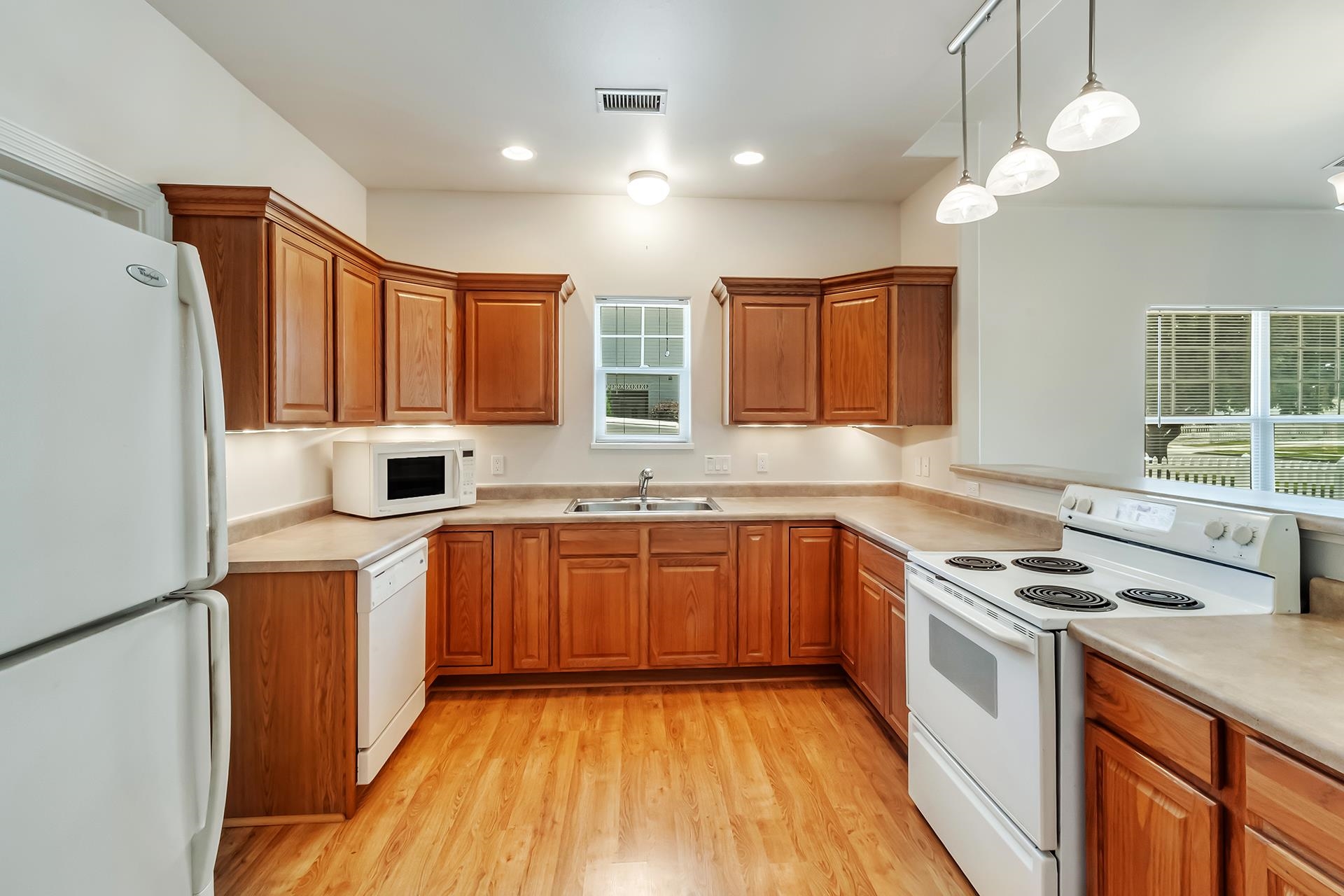 1229 Windsor Park Drive Fruita, CO 81521 - Photo 17 of 36 a kitchen with stainless steel appliances granite countertop wooden cabinets a stove top oven a sink and dishwasher