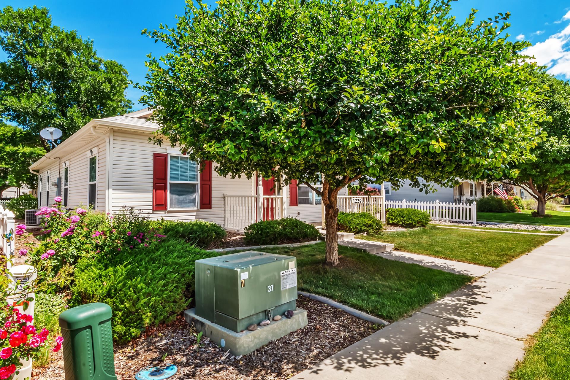 1229 Windsor Park Drive Fruita, CO 81521 - Photo 2 of 36 a front view of a house with garden