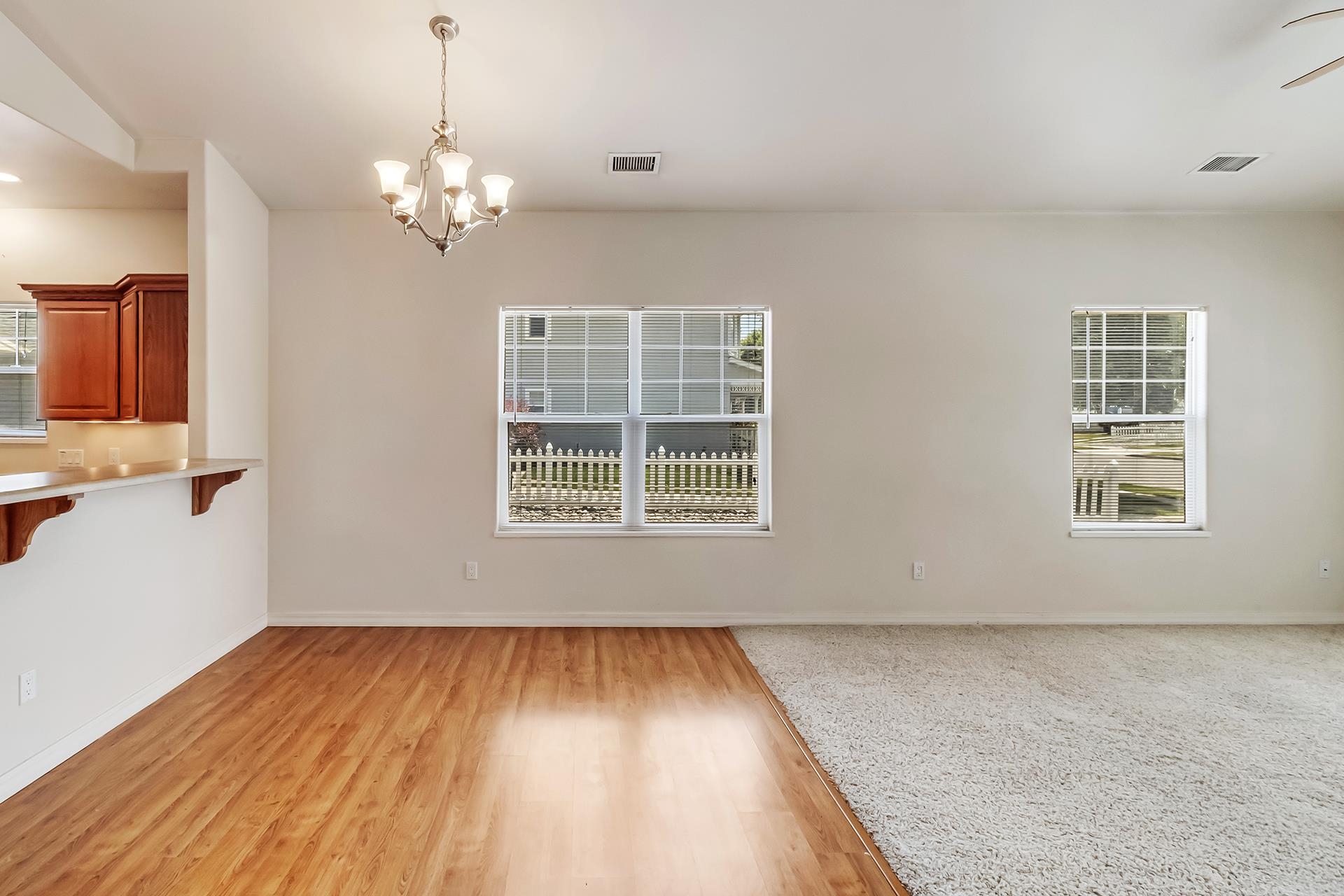 1229 Windsor Park Drive Fruita, CO 81521 - Photo 24 of 36 a view of empty room with wooden floor and fan