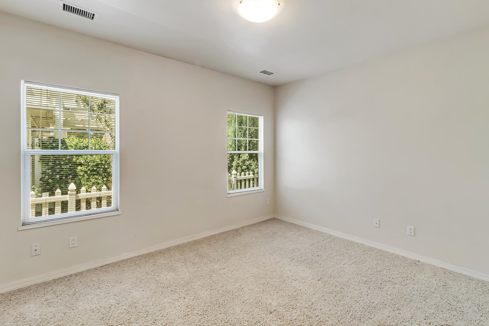 1229 Windsor Park Drive Fruita, CO 81521 - Photo 25 of 36 an empty room with windows
