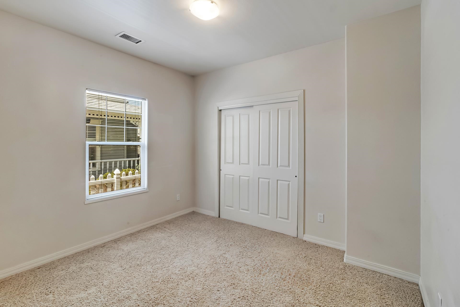 1229 Windsor Park Drive Fruita, CO 81521 - Photo 30 of 36 an empty room with windows