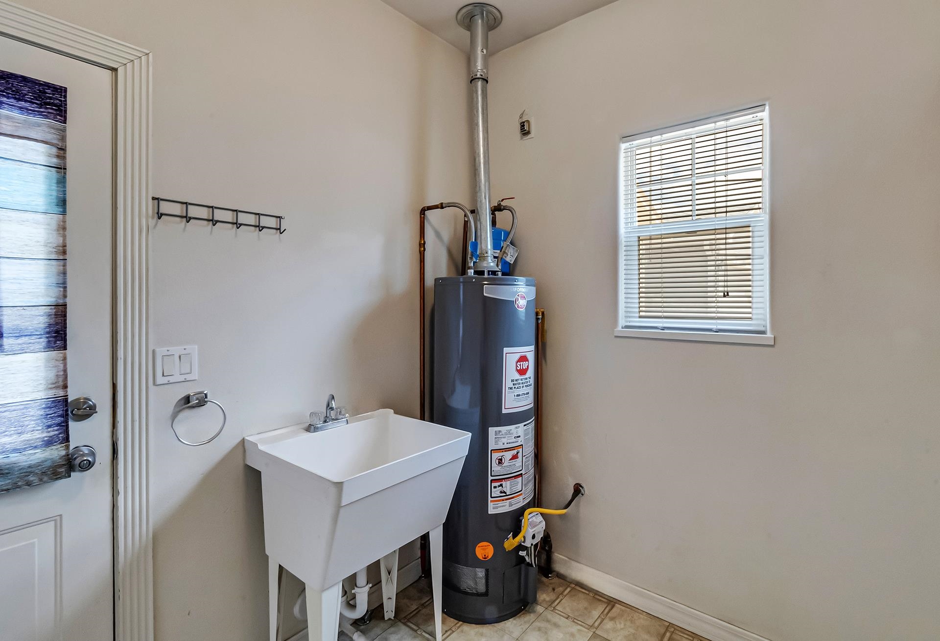 1229 Windsor Park Drive Fruita, CO 81521 - Photo 36 of 36 a bathroom with a sink and a mirror