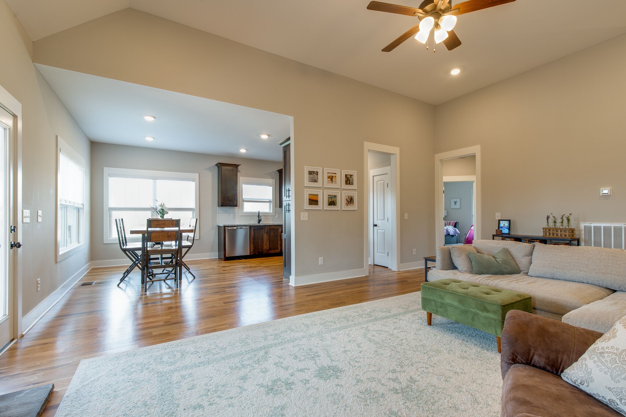 3188 Battle Creek Road Springfield, TN 37172 - Photo 7 of 49 a living room with furniture and a dining table with wooden floor