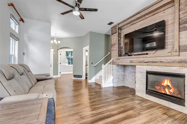 a very nice looking room with a chair and wooden floor
