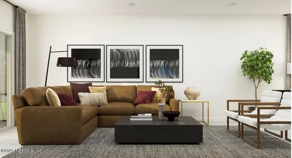 a living room with furniture and a potted plant