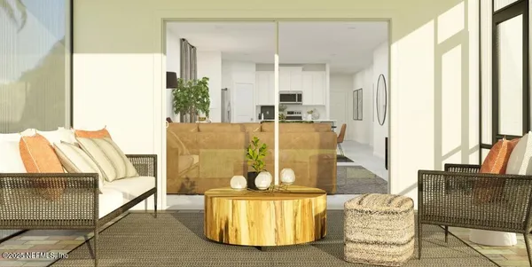 a living room with furniture and a lamp
