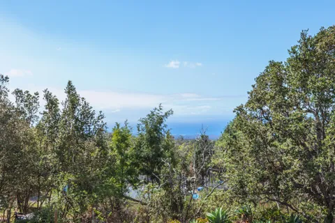 an aerial view of a house having yard basket ball court and outdoor seating